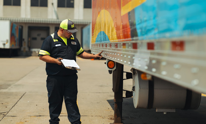 A Fleet Manager Examining a Fleet Vehicle