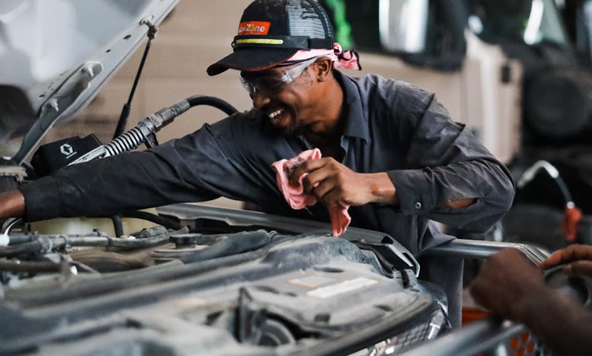 A Man Performing Fleet Vehicle Engine Maintenance