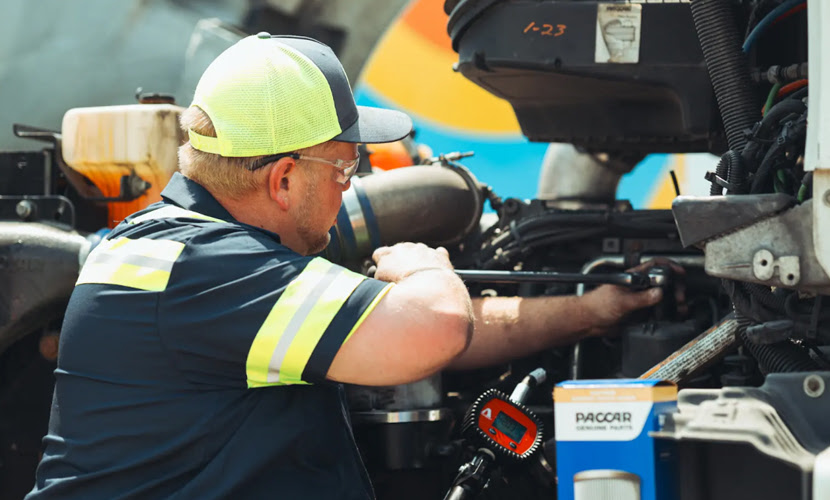 A Man Repairing a Fleet Vehicle